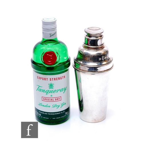 580 - A bottle of 'Export strength' Tanqueray Special Dry gin, 1980s bottling, 70cl, together with a silve... 