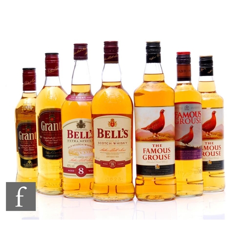 595 - Seven bottles of Scottish blended whisky, to include three bottles of Famous Grouse, two 70cl and on... 