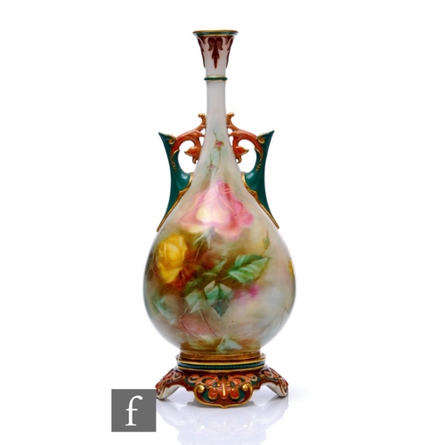 60 - A Hadley's Worcester vase or baluster twin handled form, decorated with pink and yellow roses, on fo... 