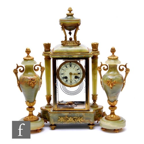 732 - A late 19th Century French onyx and gilt metal mounted clock garniture set, the eight day movement c... 