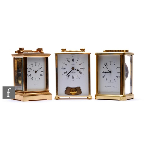 749 - A 20th Century French brass carriage clock by Routley Bath, height 13cm, and two later brass carriag... 