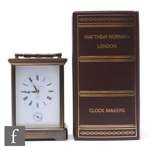 753 - A 20th Century French brass carriage clock by Matthew Norman London, incorporating seconds subsidiar... 