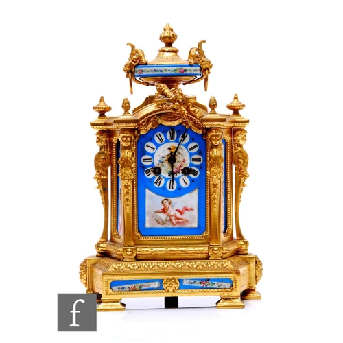 759 - A 19th Century French gilt metal mantle clock, inset with Sevres style panels painted with a cherub ... 