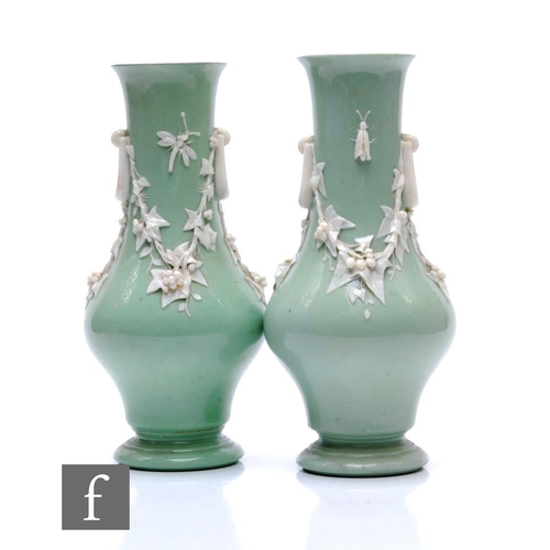 78 - A pair of Minton vases, circa 1860, each of waisted tapering footed form, glazed in pale green and d... 