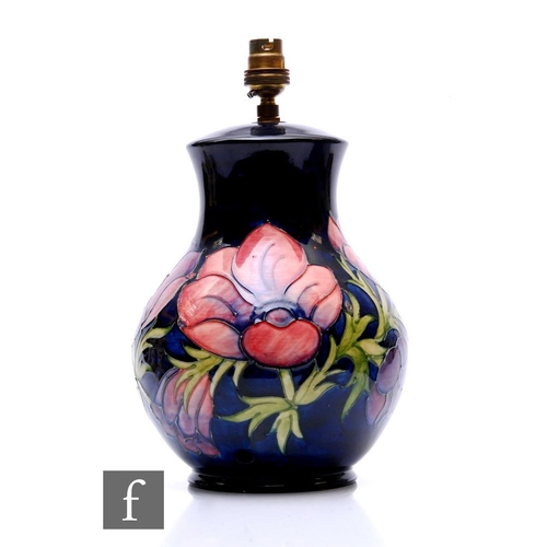 84 - A Moorcroft table lamp base decorated in the Anemone pattern against a blue ground, impressed marks,... 