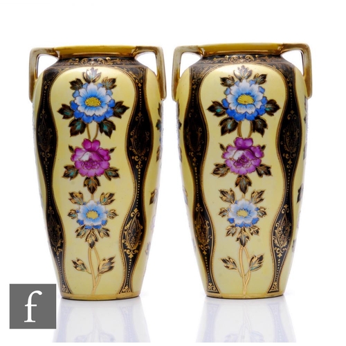 93 - A pair of Noritake vases, each of ovoid twin handled ovoid form, enamel decorated with panels of flo... 