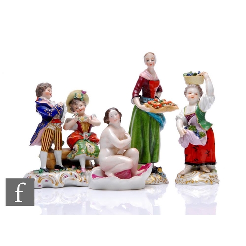 147 - A collection of 19th Century figures, including a Meissen figure of a grape picker, modelled as a ch... 