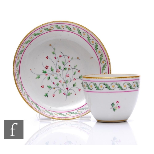 158 - An early 19th Century Derby tea bowl and saucer, painted stylised scrolling foliate and gilt star ba... 