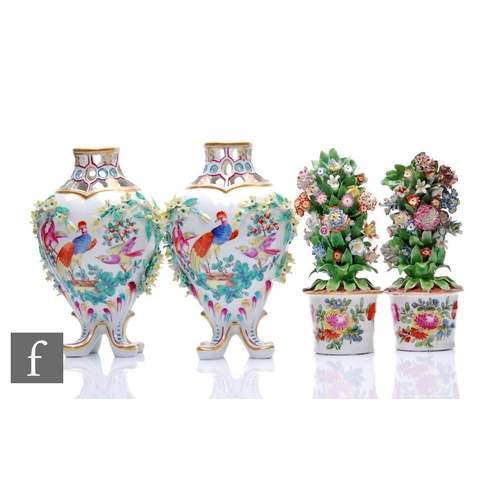 214 - A collection of Meissen style porcelain items, to include a pair of reticulated encrusted vases, dec... 