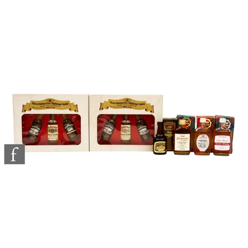 618 - A collection of whisky presentation packs and miniatures, to include 1970s/80s 100 proof Glen Grant,... 