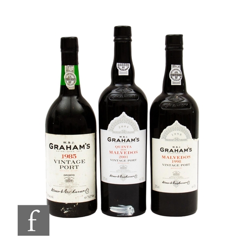 573 - Three bottles of Graham's vintage port, to include 2001 Quinta Dos Malvedos, bottled in 2003, a 1985... 