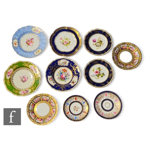 173 - A collection of early 19th Century Coalport floral patterned bowls, plates and stands, each painted ... 