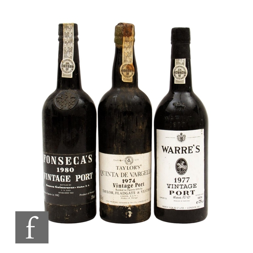 569 - Three bottles of vintage port, to include Warre's 1977, Taylor's Quinta De Vargellas 1974, bottled 1... 