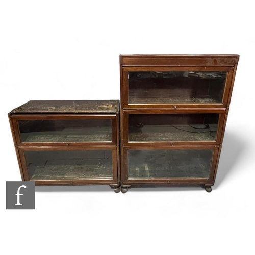 788 - A 1930s mahogany cased three sectional glazed bookcase, height 127cm x 31cm x 87cm, and an incomplet... 