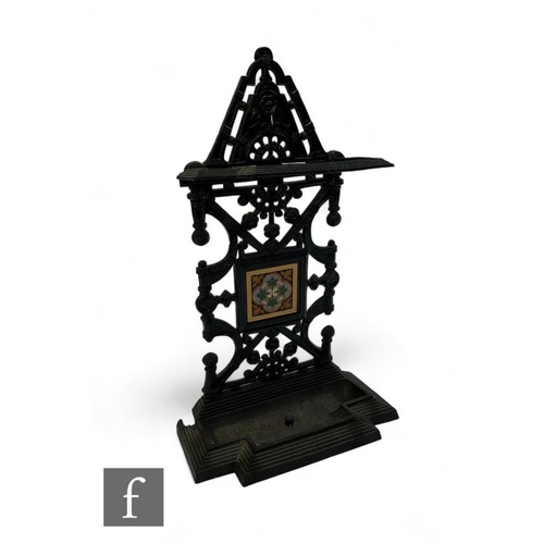 802 - A Coalbrookdale cast iron aesthetic umbrella stand after designs by Dr Christopher Dresser with tile... 