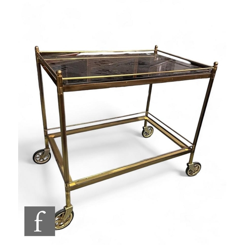 803 - A 20th Century rectangular brass trolley with smoky glass inset top, width 73cm.PLEASE VIEW CONDITIO... 