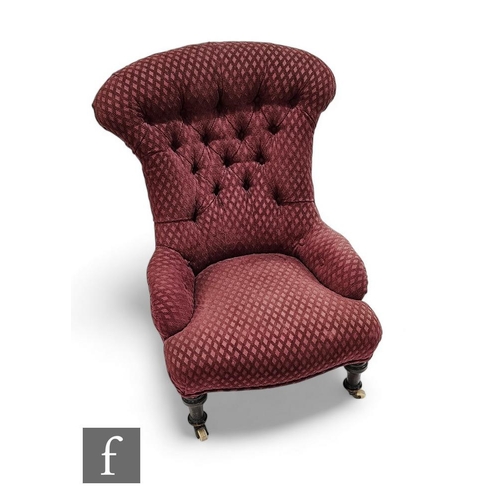 824 - A Victorian scroll buttoned back easy chair upholstered in mauve diamond design, on turned legs to t... 