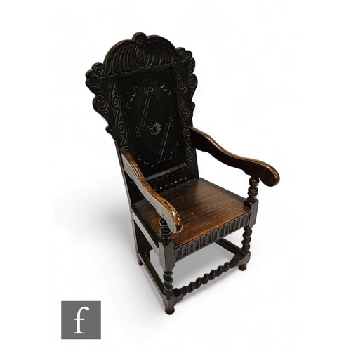 842 - A 19th Century oak Wainscot chair, the diamond carved panel and scroll back above a plank seat, scro... 