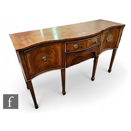 858 - A George III style mahogany crossbanded serpentine front sideboard, the bowfront section fitted with... 