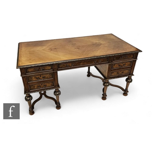 865 - A 20th French Empire style walnut kneehole writing desk, crossbanded quarter veneered top, silvered ... 