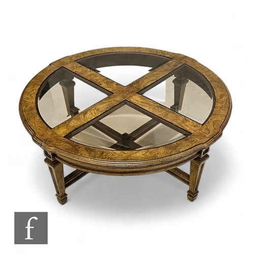 872 - A 20th Century light figured walnut circular occasional table, shaped moulded edge top on tapering l... 