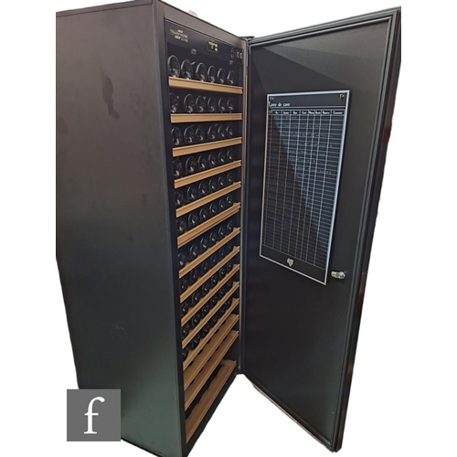 668 - A contemporary wine fridge by Transtherm, solid black powder coat finish, single locking door openin... 