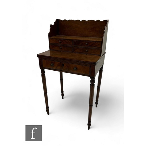 792 - A small 19th Century George IV writing desk, the superstructure fitted with four short drawers over ... 