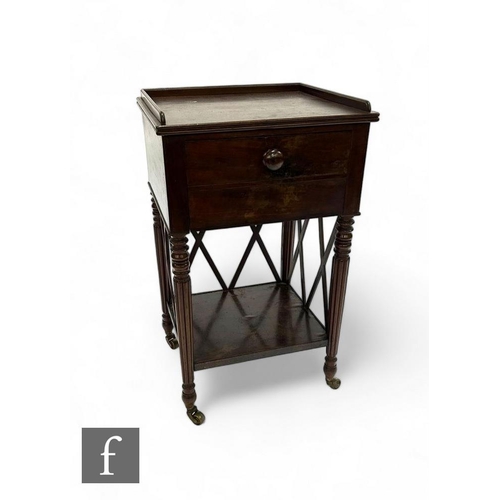 836 - A George IV mahogany tray top bedside cupboard with dummy drop flap door on ring turned reeded legs ... 