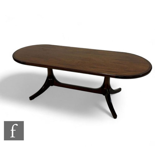 845 - A 20th Century mahogany coffee table on splayed legs, width 124cm.PLEASE VIEW CONDITION REPORT... 