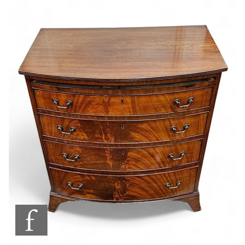 866 - A George III mahogany bow fronted bachelor's chest of four long graduated drawers, lacking slide, on... 