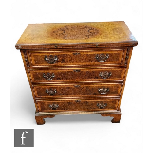 868 - A George I style figured walnut straight front chest of four long drawers below a crossbanded and wa... 