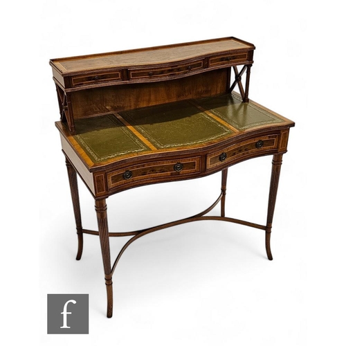 873 - A 20th Century yew wood Bon heur de jour, the green leather inset top over two short drawers, on ree... 