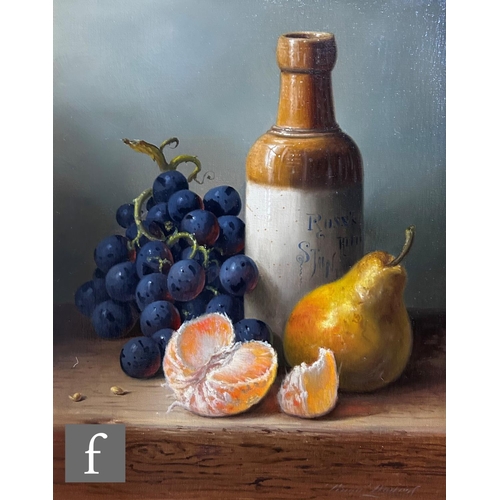 458 - BRIAN DAVIES (1942-2014) - A still life with stoneware bottle and fruit on a table top, oil on canva... 