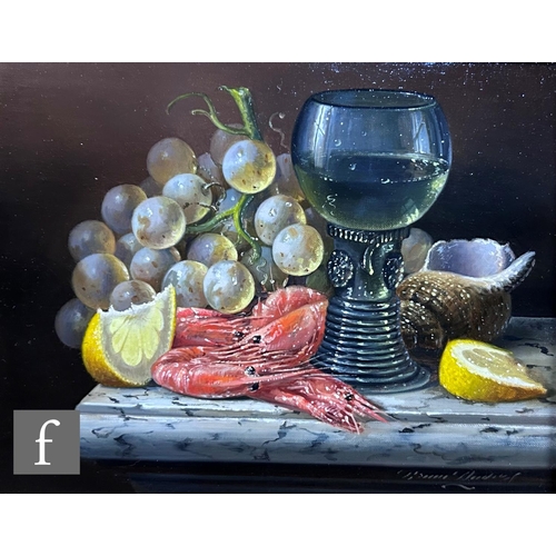 475 - BRIAN DAVIES (1942-2014) - A still life composition with wine glass, grapes and prawns on a marble l... 