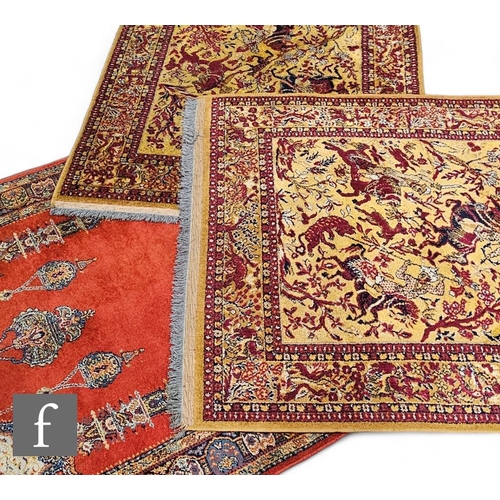 877 - A pair of Agra style rugs with Maharaja hunting on a beige ground within in a multi red border, 200c... 