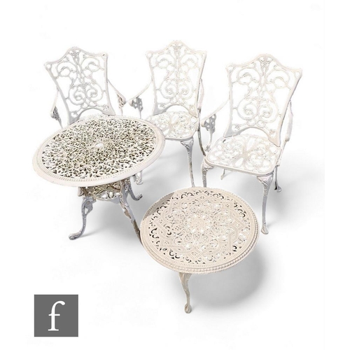 899 - Five items of white painted metal garden furniture to include a table, three armchairs and a low cof... 