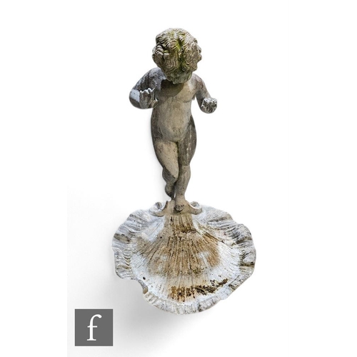 901 - A patinated lead garden figure of classical form, depicting a putti before a clam shell, height 59cm... 