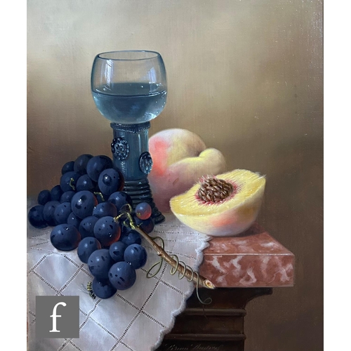 459 - BRIAN DAVIES (1942-2014) - A still life with peach, grapes and wine glass on a marble ledge, oil on ... 