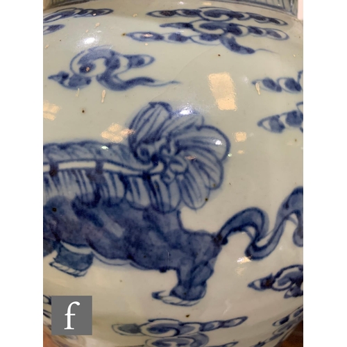 47 - A pair of Chinese blue and white jars and covers, each of baluster form, surmounted by a domed cover... 