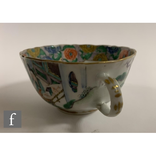 55 - A Chinese Daoguang period teacup, of U form with scalloped rim and loop handle, decorated with figur... 