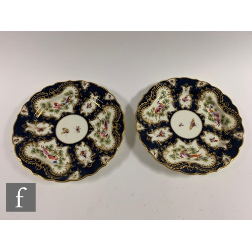 209 - A late 18th Century Worcester blue scale ground teacup and saucer, with hand painted cartouche panel... 