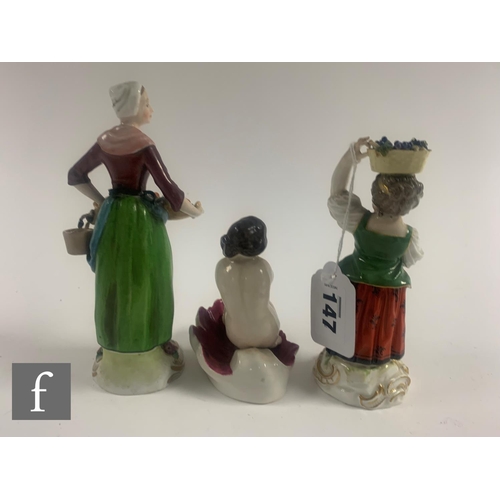 147 - A collection of 19th Century figures, including a Meissen figure of a grape picker, modelled as a ch... 