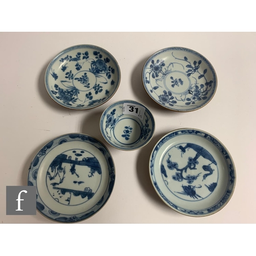 31 - A collection of Chinese shipwreck porcelain, to include a matched tea bowl and saucer with three ass... 