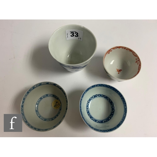 33 - Two 18th Century Nanking Cargo shipwreck porcelain tea bowls and saucers, each with stylised floral ... 