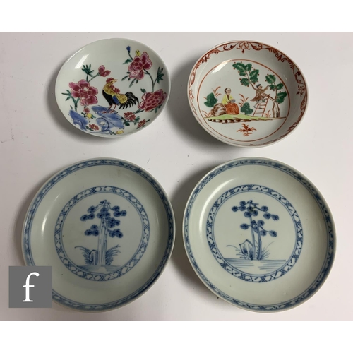 33 - Two 18th Century Nanking Cargo shipwreck porcelain tea bowls and saucers, each with stylised floral ... 