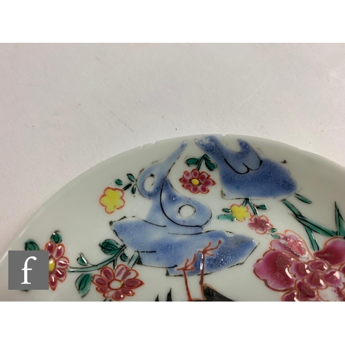 33 - Two 18th Century Nanking Cargo shipwreck porcelain tea bowls and saucers, each with stylised floral ... 