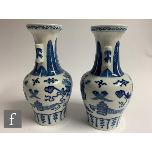 58 - A pair of Chinese Kangxi style blue and white 'Arrow' vases, each of baluster form, decorated with p... 