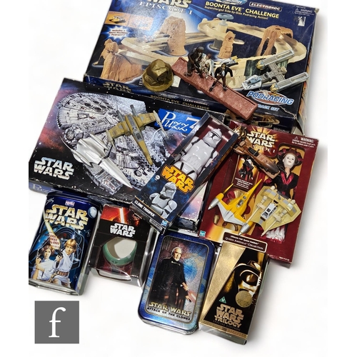 237 - A collection of Star Wars related toys and merchandise, to include a 3D puzzle, Star Wars Episode 1 ... 