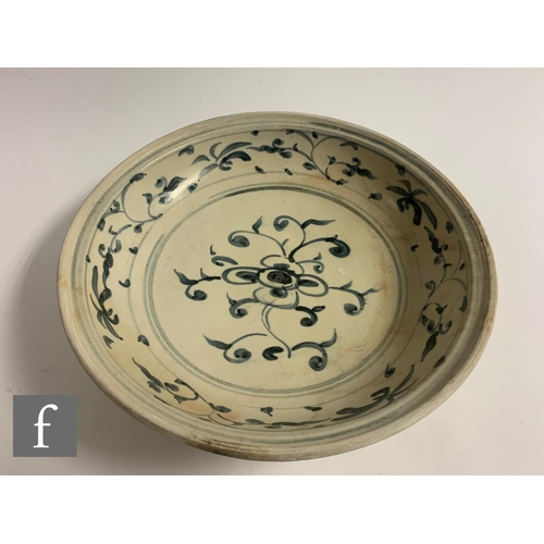 36 - A 15th Century Hoi An hoard Vietnamese Shipwreck large shallow bowl, decorated with a leaf scroll pa... 