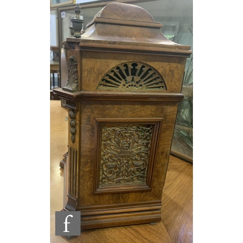 766 - A late 19th Century figured walnut bracket clock, the eight day movement enclosed by an arched dial ... 